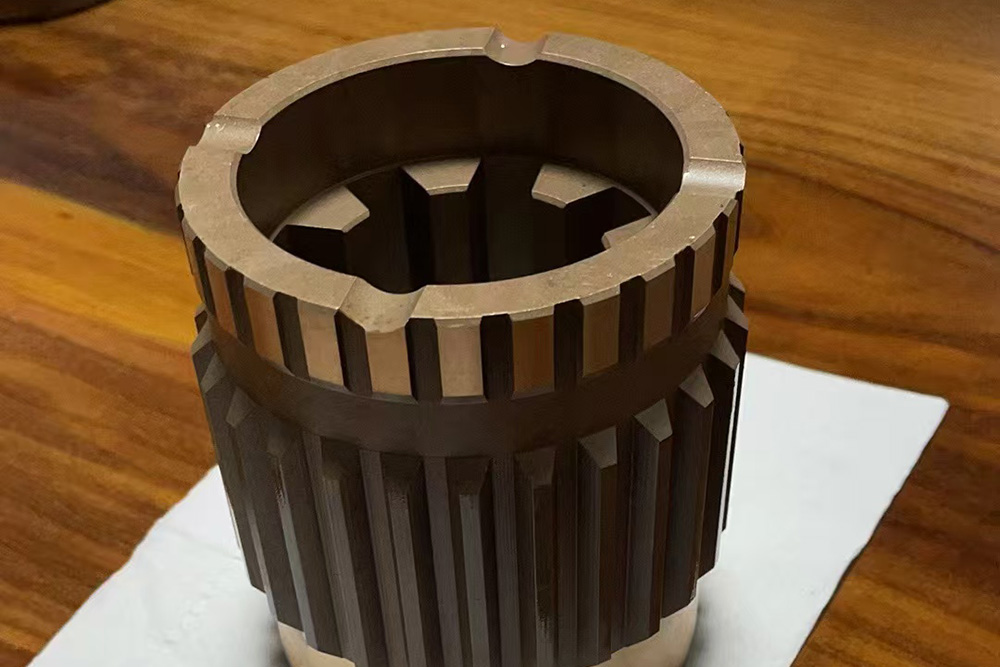 Rock drilling machine wear-resistant sleeve
